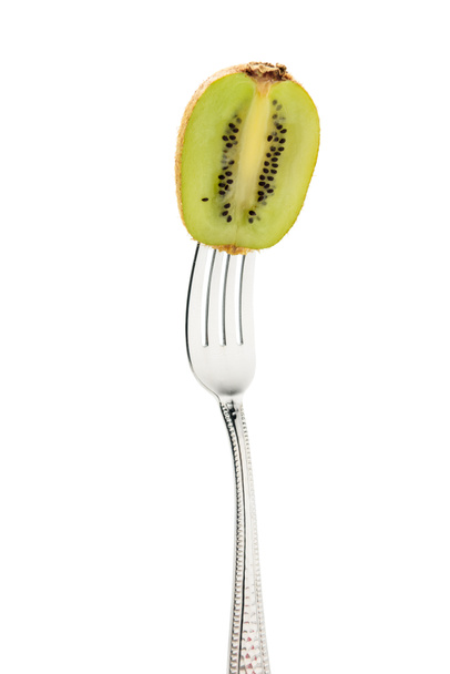 kiwi fresco sulla forchetta
  - Foto, immagini