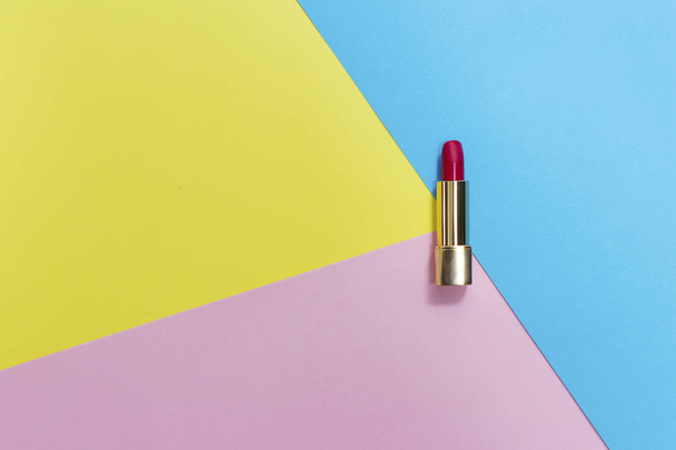Top view of makeup set: red lipstick on pastel background. - Valokuva, kuva