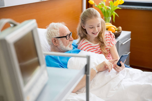 grandfather and child using smartphone  - Foto, immagini