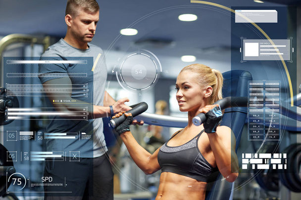 man and woman flexing muscles on gym machine - Zdjęcie, obraz