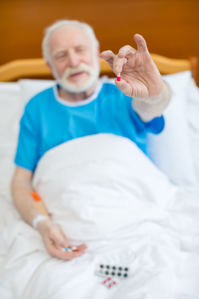 Senior man with pills  - Photo, Image