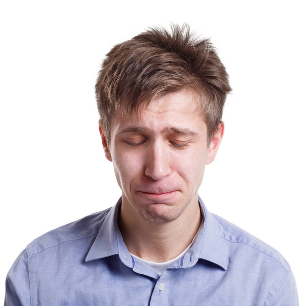 Sad man face expressing negative emotion, isolated - Photo, image