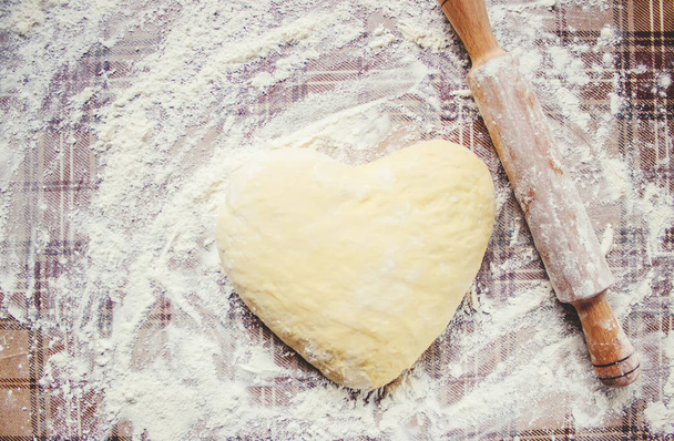 Yeast dough on the table. Cooking baking. Selective focus.  - Foto, imagen