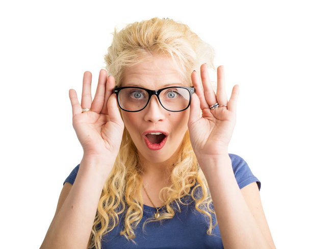 Woman with new optical glasses on showing her surprise - Photo, Image
