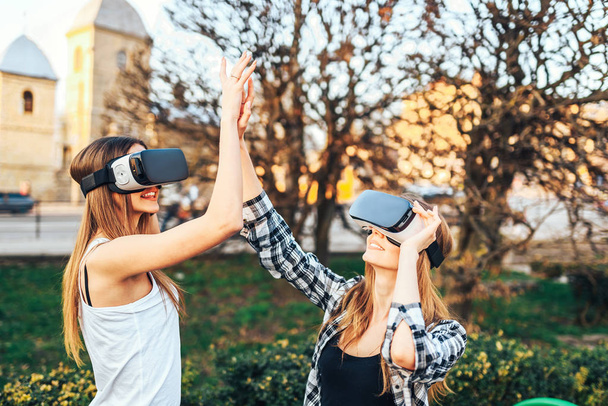 girls enjoy virtual reality glasses - Foto, immagini