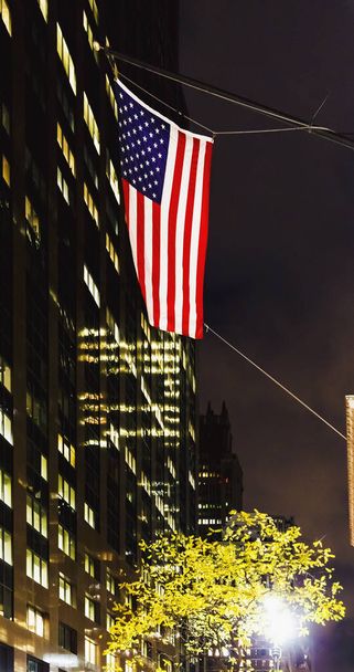 American flag waving from Manhattan's (New York) buildings at ni - Photo, Image