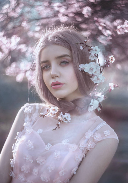 A young girl in spring in a luxurious dres - Photo, Image