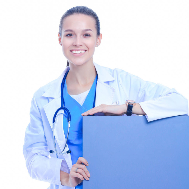 A female doctor with a blank billboard - Fotografie, Obrázek