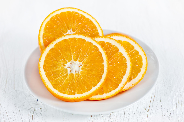 Orange on the plate - Foto, afbeelding