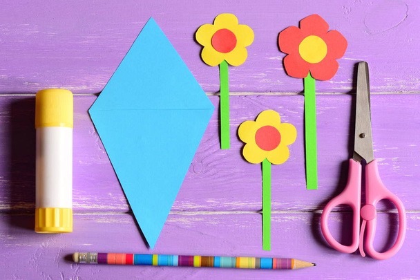 Making paper crafts for mother's day or birthday. Step. Paper flowers, scissors, glue stick, flowers templates, pencil on a table. Set for kids art activity at home or in kindergarten. Top view - Photo, Image