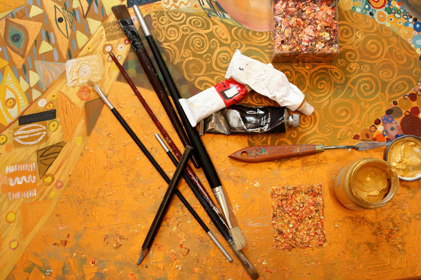 Painted Canvas, palette, brushes and oil paint tubes. Painter work place. Art concept. - Fotó, kép