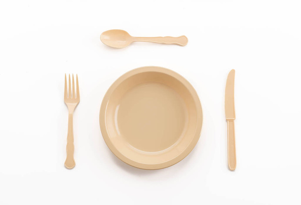 plastic plate spoon fork and knife - 写真・画像