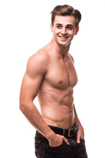 Well built shirtless muscular male model against white background - Fotoğraf, Görsel