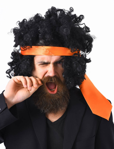 caucasian hipster in suit and black curly tie-tied afro wig - Foto, immagini