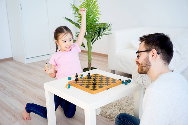 Family playing chess - Photo, image
