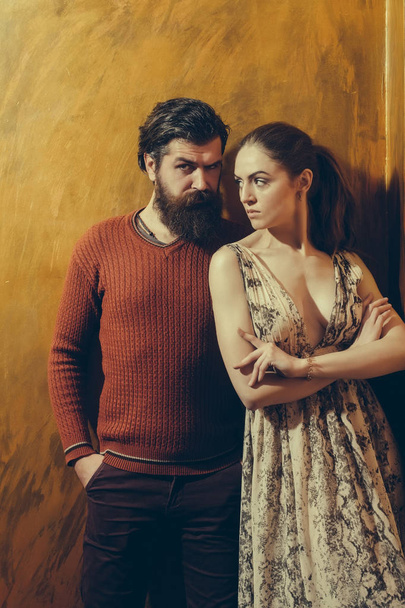Pretty girl and serious bearded man with beard - Valokuva, kuva