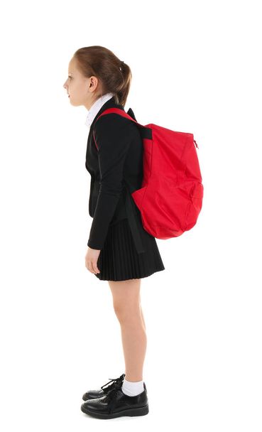 Cute schoolgirl with backpack on white background - Foto, Imagem