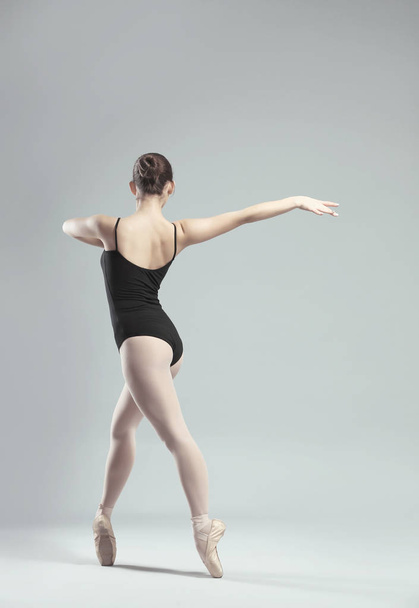 Young beautiful ballerina dancing - Fotó, kép