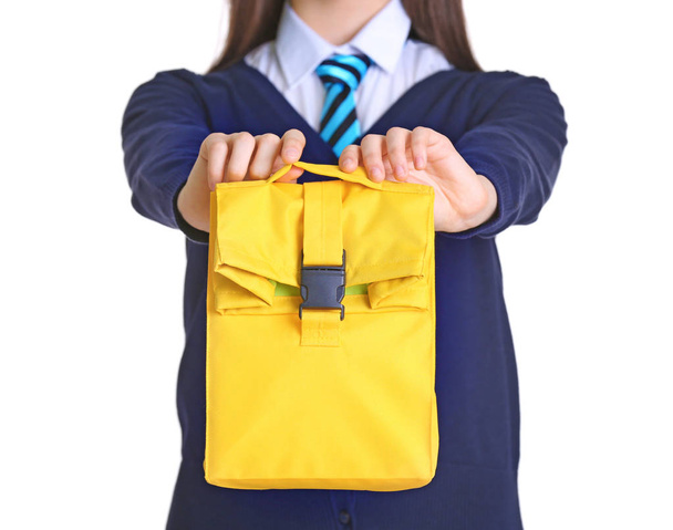 Cute schoolgirl with lunch bag  - Fotó, kép