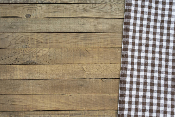 picknick deken bovenaanzicht op houten tafel - Foto, afbeelding