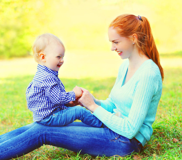 Portrait happy smiling mother and son child outdoors in a sunny  - Photo, Image