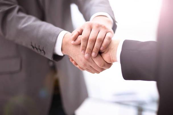 Close up view of business partnership handshake concept.Photo of two businessman handshaking process.Successful deal after great meeting. - Фото, изображение