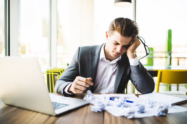 Accountant businessman working with documents in office having a stress. - Photo, Image
