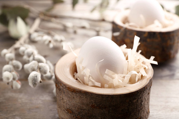 eggs in wooden stands  - Foto, afbeelding