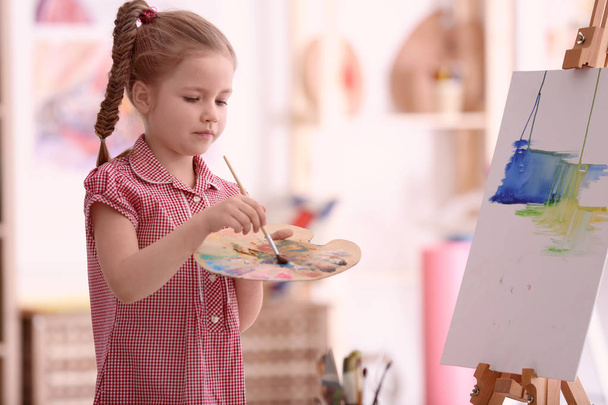 Cute little artist painting picture - Photo, image