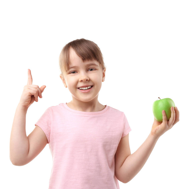 Happy schoolgirl sitting with apple   - Photo, Image