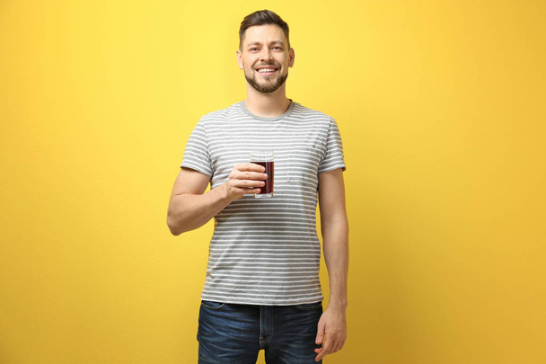 Handsome man posing with juice - Fotoğraf, Görsel
