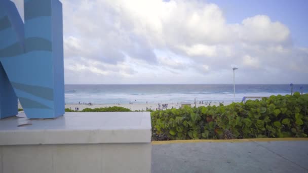 Left pan of the Cancun sign on the beach - Felvétel, videó