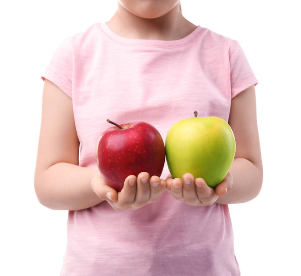 Schoolgirl holding apples in hands - Fotó, kép