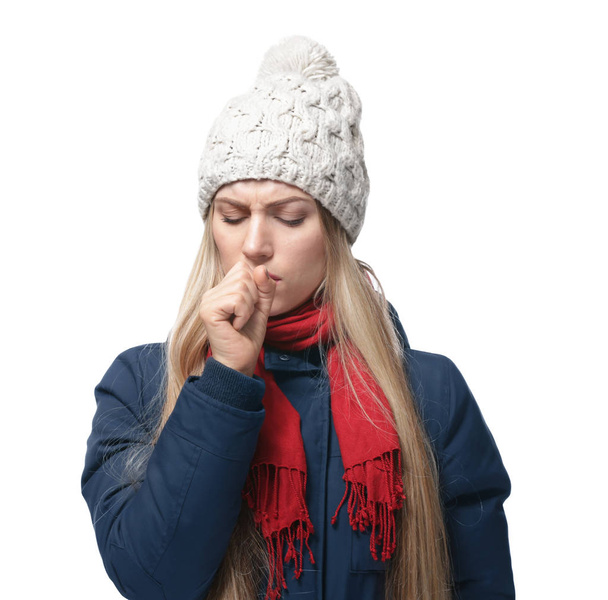Young woman coughing on white background - 写真・画像