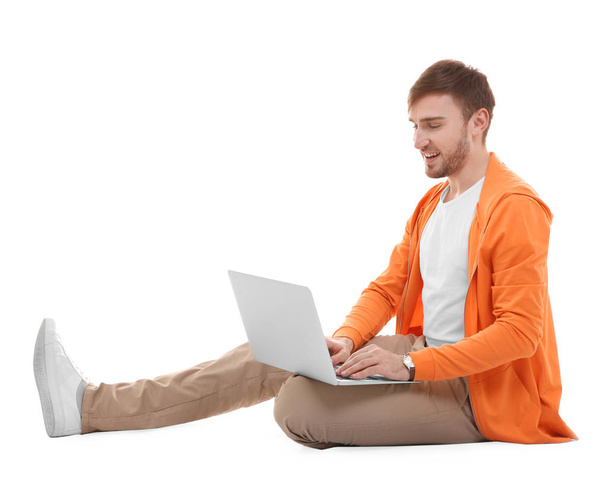 Handsome young man with laptop  - Photo, Image