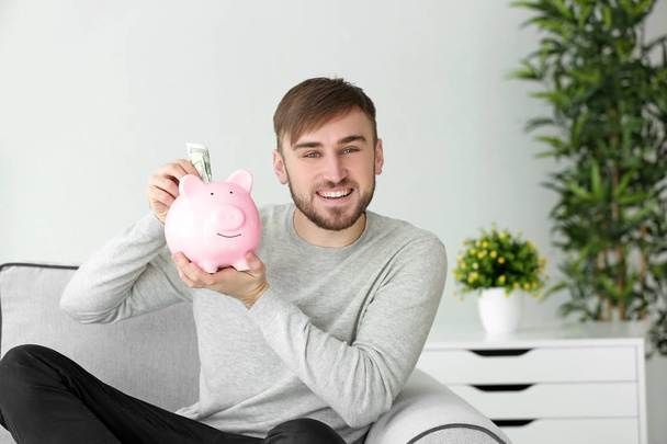 man with piggy bank  - Foto, Bild