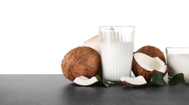 Glass of coconut milk with nuts  - Фото, зображення