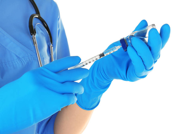 Doctor in gloves with syringe  - Foto, afbeelding