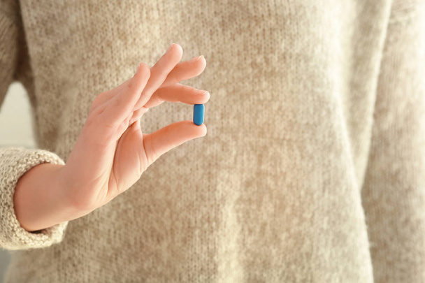 Young woman with pill - Photo, Image
