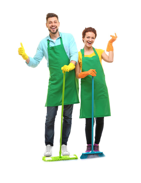 Couple with cleaning supplies on white background - Fotografie, Obrázek