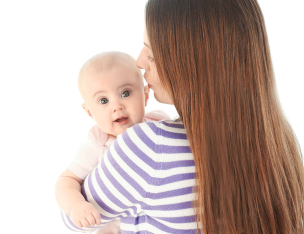 Adorable baby with mother on light background - Photo, image
