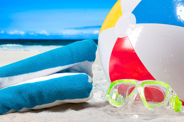 Summer vacation. Mask goggles and color ball on beach background - Zdjęcie, obraz