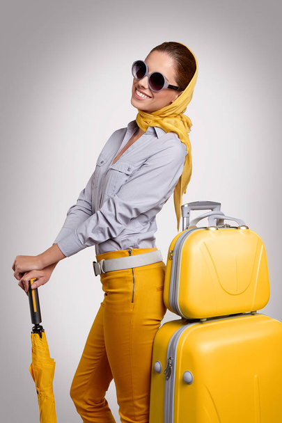 Glamour woman with yellow suitcase - Valokuva, kuva