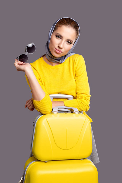 Glamour woman with yellow suitcase - 写真・画像