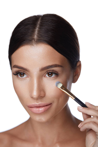 Beauty Woman Face Makeup. Beautiful Woman With Cosmetic Brush - Photo, Image
