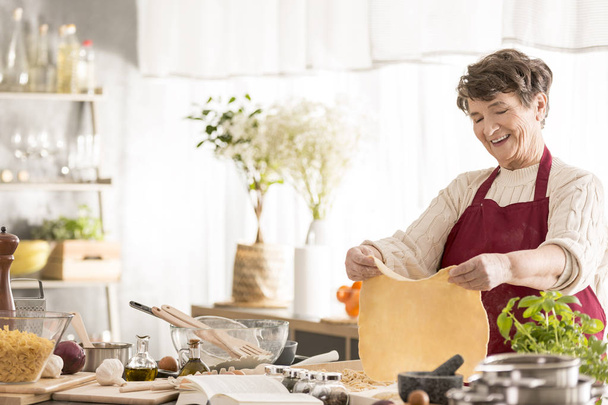 Grandma making a dough - Φωτογραφία, εικόνα