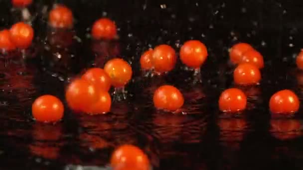 Three videos of falling cherry tomatoes in real slow motion - Footage, Video
