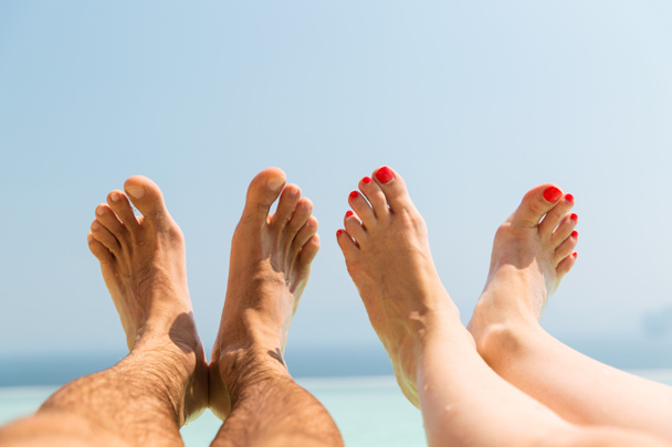 couple of feet on beach - Photo, image