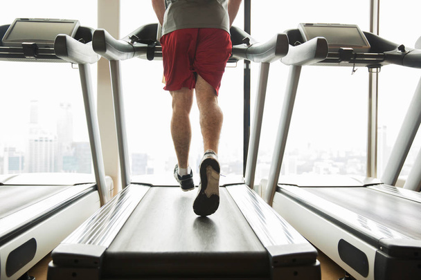 man exercising on treadmill in gym - Photo, image