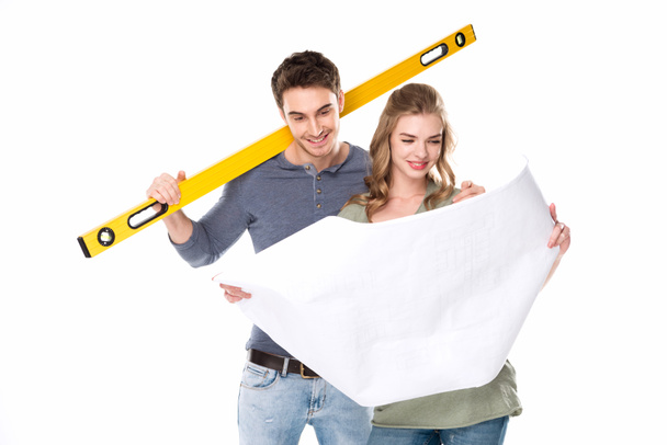 Young couple with blueprint  - Photo, Image